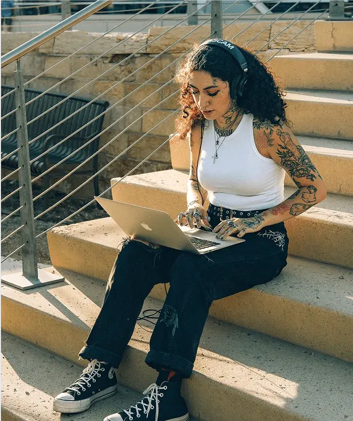 A lady listening music on her laptop